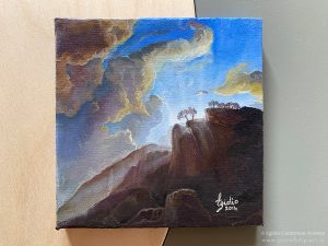 Paesaggio a olio su tela di 10x10 cm raffigurante il sorgere del sole dietro un monte.